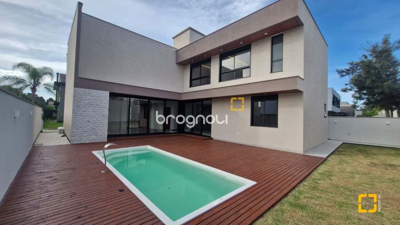Casa alto padrão a venda em condomínio ao lado do Costão Golf — foto principal