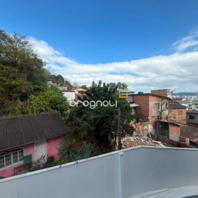 Apartamento com 59m², 2 quartos (sendo 1 suíte), 1 garagem, no bairro Coqueiros em Florianópolis
